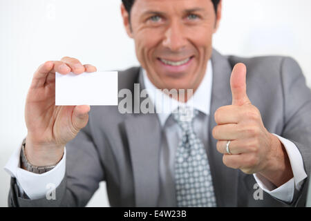 Geschäftsmann mit Karte Stockfoto