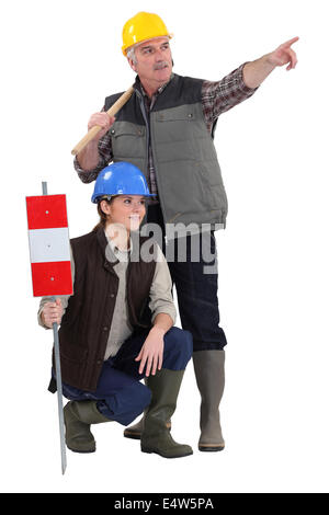 Handwerker, die von ihrer Arbeit abgelenkt zu werden Stockfoto