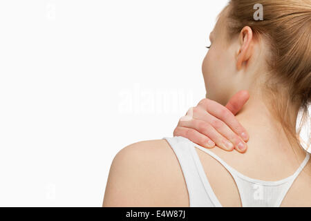 Frau massiert ihre schmerzenden Nacken Stockfoto