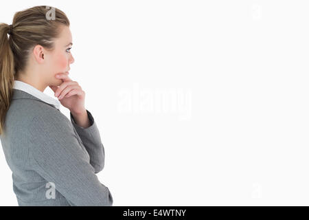 Blonde Unternehmerin denken Stockfoto