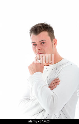 Ernst junger Mann tief in Gedanken Stockfoto
