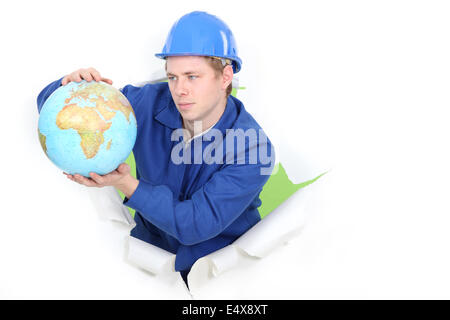 Kaufmann hält einen Globus Stockfoto