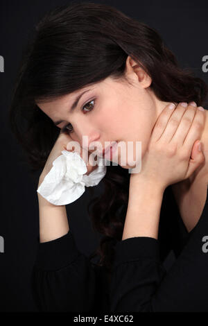 Frau leidet Nackenschmerzen Stockfoto