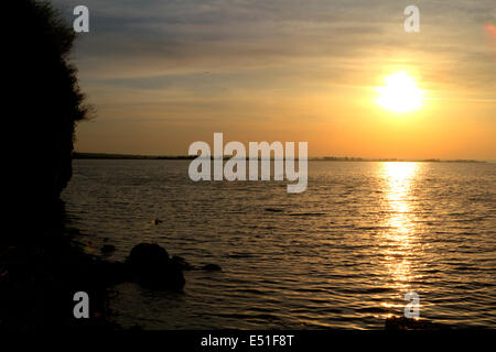 Sonnenuntergang am Strand Stockfoto