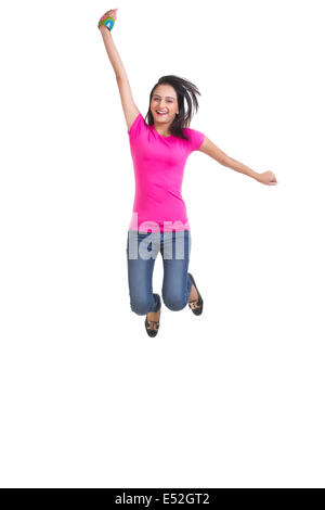 In voller Länge Portrait von glückliche junge Frau springen über weißem Hintergrund Stockfoto