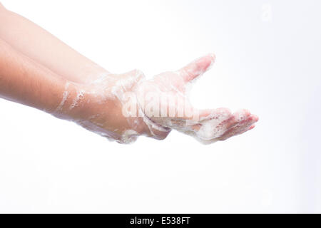 Ein Mann wäscht He Hände mit Seife. Isoliert auf weiss Stockfoto