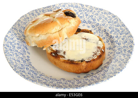 Geröstete gebutterte Hot Cross Bun Stockfoto