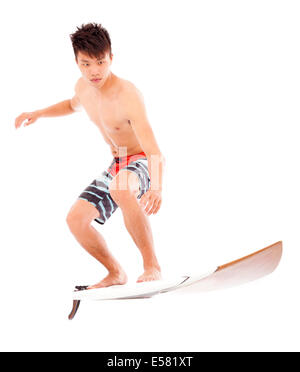 junge Profisurfer Praxis Surfen pose Stockfoto