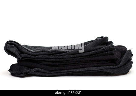 Schwarze Baumwollsocken auf einem Stapel Stockfoto