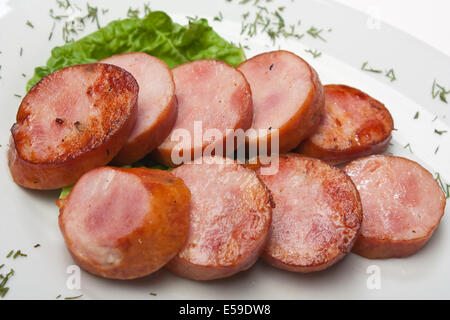 gehackte Würste gebraten mit Gemüse und Gewürzen Stockfoto