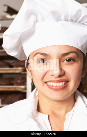 Hispanische Bäcker lächelnd Stockfoto