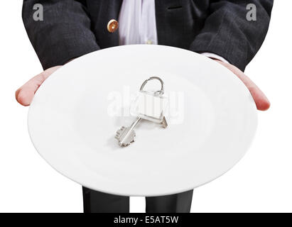 Vorderansicht der Geschäftsmann hält weiße Platte mit neuen Türschlüssel isoliert auf weißem Hintergrund Stockfoto