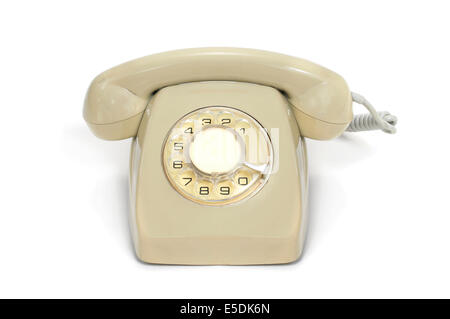eine Beige alte Rotary Durchwahltelefon auf weißem Hintergrund Stockfoto