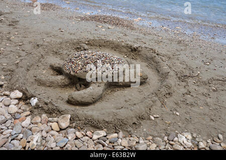 Sea Turtle sand Skulptur am Sandstrand. Sommerurlaub. Stockfoto