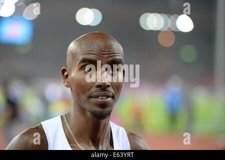 Zürich, Schweiz. 13. August 2014. Sieger Mohamed 'Mo' Farah aus Großbritannien reagiert nach dem Gewinn der Männer 10'000 m Finale bei den Europäischen Leichtathletik Weltmeisterschaften 2014 im Letzigrund Stadion in Zürich, Schweiz, 13. August 2014. Foto: Bernd Thissen/Dpa/Alamy Live News Stockfoto