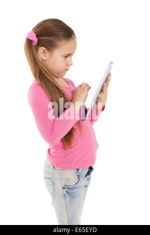 Niedliche kleine Mädchen mit TabletPC Stockfoto