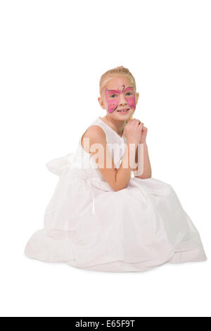 Glückliche kleine Mädchen in Schmetterling Gesicht malen Stockfoto