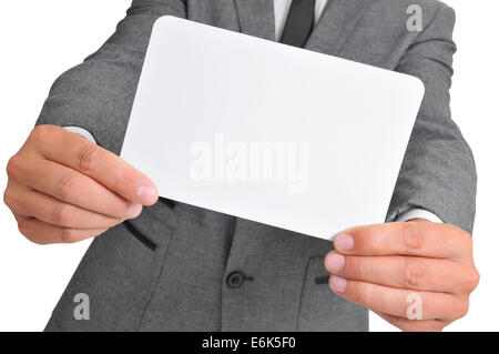 ein Mann trägt einen Anzug hält eine leere Schild Stockfoto