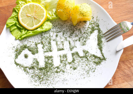 Silhouette Fisch in Dill auf Platte abstrakte Food Konzept Stockfoto