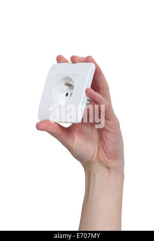 Hand, die eine europäische Steckdose Stockfoto