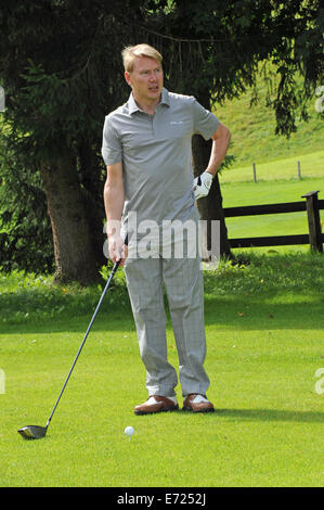 Going, Österreich. 03rd September 2014. Ehemalige finnische Formel 1 Fahrer Mika Haekkinen spielt eine Runde Golf im "Kaiser Trophy" golf-Turnier im Rahmen der Veranstaltung "Camp Beckenbauer" in Reith, Deutschland, 3 Septmeber 2014. © Dpa picture-Alliance/Alamy Live News Stockfoto