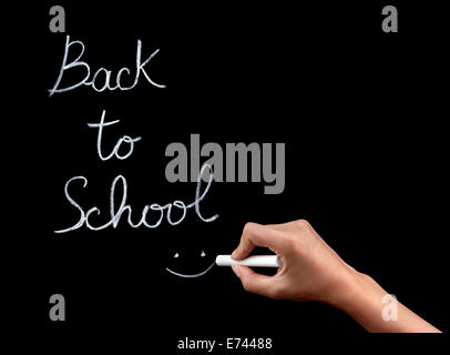 Frau Handschrift auf Tafel Phrase: "back to School", weiblichen Körperteil, Beginn der pädagogischen Saison Konzept Stockfoto