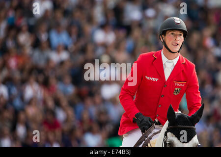 Caen, Frankreich. 06. Sep, 2014. Fahrer Daniel Deusser Deutschlands auf Pferd "Cornet d ' Amour" konkurriert in der Geschwindigkeit springen Wettbewerb während der World Equestrian Games 2014 in Caen, Frankreich, 6. September 2014. Foto: Rolf Vennenbernd/Dpa/Alamy Live News Stockfoto