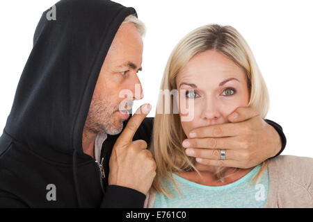 Nahaufnahme des Diebstahls der Frau den Mund zu Stockfoto