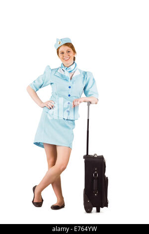 Hübsche Stewardess lächelt in die Kamera Stockfoto