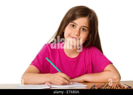 Nette Schüler arbeiten an ihrem Schreibtisch Stockfoto