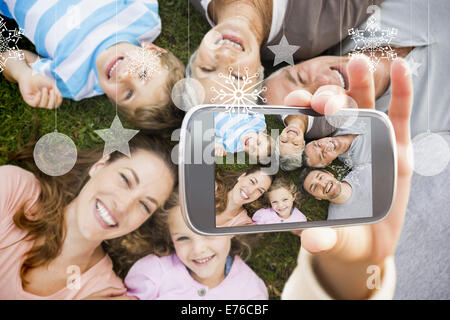 Zusammengesetztes Bild von Hand mit smartphone Stockfoto