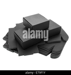 Faltbare schwarzes Papier-Boxen auf einem weißen Hintergrund. Stockfoto