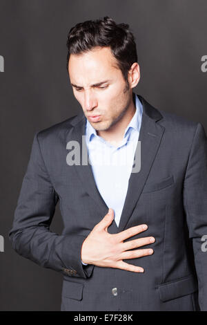 Geschäftsmann Magenschmerzen leiden Stockfoto