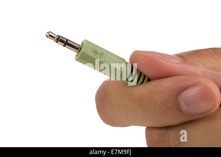 Hand mit Audiokabel isoliert auf weißem Hintergrund Stockfoto