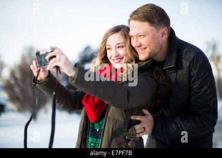 Das Fotografieren selbst und Mann Frau Stockfoto