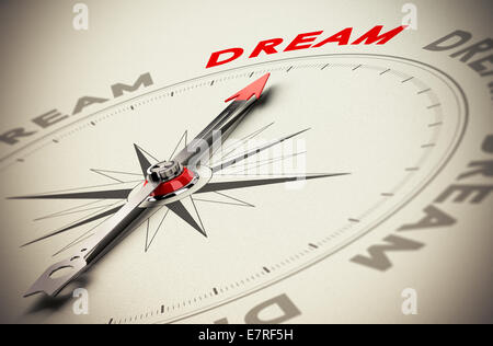 Kompass mit roten Zeiger verweist das Wort Traum, Beige Papierhintergrund, Symbol der Träume zu erreichen Stockfoto