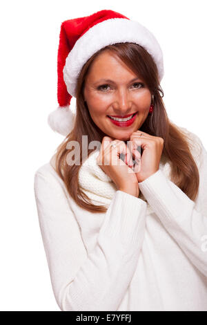 Attraktive Frau trägt eine festliche rote Weihnachtsmütze Stockfoto