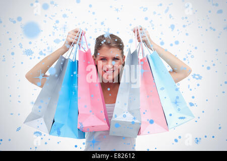 Joyful woman holding shopping bags Stockfoto