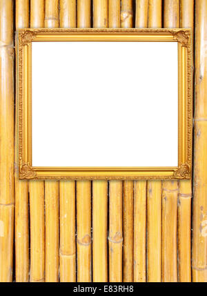 leere Goldrahmen auf Bambus Wand Hintergrund Stockfoto