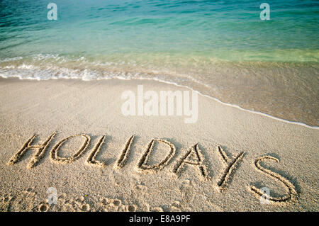 das Wort "Urlaub" in Sand beach, Koh Lipe, Thailand zerkratzt Stockfoto