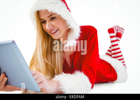 Festliche Blondine mit TabletPC Stockfoto