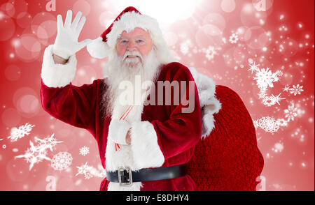 Zusammengesetztes Bild von Santa Claus winken Stockfoto