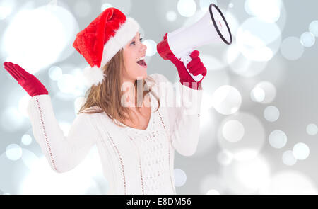Zusammengesetztes Bild von festlichen blonde schreien über Megaphon Stockfoto