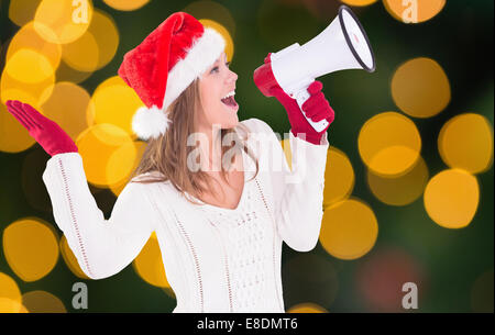 Zusammengesetztes Bild von festlichen blonde schreien über Megaphon Stockfoto