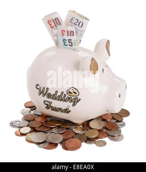 Sparschwein Hochzeit Fonds mit UK Sterling Münzen und Banknoten Stockfoto