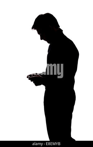 Mann SMS mit beiden Händen in der Silhouette isoliert auf weißem Hintergrund Stockfoto