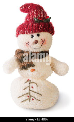 Lächelnd Schneemann Spielzeug gekleidet in Schal und Mütze isoliert auf weißem Hintergrund Stockfoto
