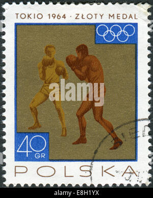 Briefmarke gedruckt in Polen zeigt die Siege gewann die polnische Mannschaft bei den Olympischen Spielen 1964, Boxen Stockfoto