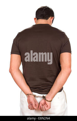Verhaftet kriminelle steht mit den Händen hinter seinem Rücken mit Handschellen gefesselt. Stockfoto