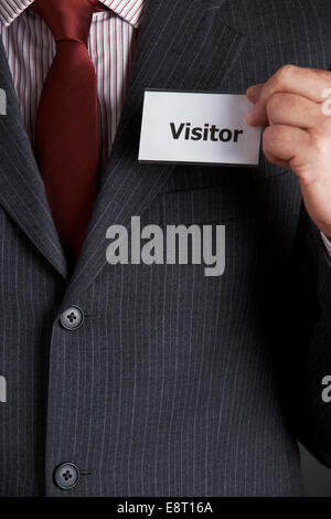 Geschäftsmann Jacke Besucherausweis zuweisen Stockfoto